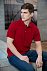 Рубашка поло мужская Sunset, красная с логотипом в Астрахани заказать по выгодной цене в кибермаркете AvroraStore